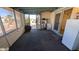 Enclosed patio featuring a door to the backyard, storage, and ample space for relaxation or hobbies at 1116 E 11Th E St, Casa Grande, AZ 85122