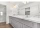 Bathroom featuring dual sinks, marble countertops, and a glass enclosed shower at 11260 N 92Nd St # 2058, Scottsdale, AZ 85260