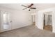 Bright bedroom featuring carpet, ceiling fan and access to private balcony at 11260 N 92Nd St # 2058, Scottsdale, AZ 85260