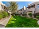 Buildings line a well-manicured lawn, featuring trees, bushes, and walking path at 11260 N 92Nd St # 2058, Scottsdale, AZ 85260