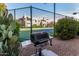 Outdoor grilling area featuring a gas grill, cactus and nearby tennis court at 11260 N 92Nd St # 2058, Scottsdale, AZ 85260