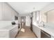 Modern kitchen with stainless steel appliances and light gray cabinetry at 11260 N 92Nd St # 2058, Scottsdale, AZ 85260