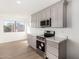 Modern kitchen with stainless steel appliances, light gray cabinetry and eat-in area at 11260 N 92Nd St # 2058, Scottsdale, AZ 85260