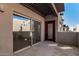 A private patio features neutral stucco walls, concrete flooring, and a covered pergola at 11260 N 92Nd St # 2058, Scottsdale, AZ 85260