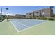 Well-maintained tennis court with community buildings in the background on a sunny day at 11260 N 92Nd St # 2058, Scottsdale, AZ 85260