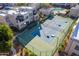 Aerial view of the tennis court surrounded by desert landscaping and multi-story residential buildings at 11260 N 92Nd St # 2058, Scottsdale, AZ 85260