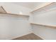 Spacious walk-in closet with multiple wooden clothes racks and shelves at 11260 N 92Nd St # 2058, Scottsdale, AZ 85260