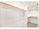 Spacious walk-in closet with multiple wooden clothes racks and shelves at 11260 N 92Nd St # 2058, Scottsdale, AZ 85260