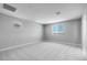 Neutral bedroom boasts plush carpeting, recessed lights, and a multitude of windows at 12219 W Caraveo Pl, Peoria, AZ 85383