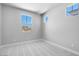 Bedroom featuring soft carpet, neutral walls and a large window to let in natural light at 12219 W Caraveo Pl, Peoria, AZ 85383