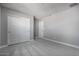 A bedroom showcasing a closet with sliding doors, neutral paint and soft carpet at 12219 W Caraveo Pl, Peoria, AZ 85383
