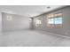 Spacious bonus room featuring plush carpeting, recessed lights, and a multitude of windows at 12219 W Caraveo Pl, Peoria, AZ 85383