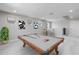 Spacious game room featuring a pool table with a wood frame and light gray felt and neutral colored walls at 12219 W Caraveo Pl, Peoria, AZ 85383