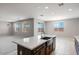 Kitchen area featuring an island with a sink, view of the backyard and open floor plan at 12219 W Caraveo Pl, Peoria, AZ 85383