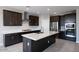 Modern kitchen boasts stainless appliances, stylish cabinets, and a spacious center island at 12219 W Caraveo Pl, Peoria, AZ 85383