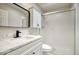 Bathroom featuring modern vanity with marble countertop, black hardware and updated glass shower at 12627 N La Montana Dr # 104, Fountain Hills, AZ 85268