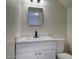Renovated bathroom featuring marble vanity, black fixtures and ample lighting at 12627 N La Montana Dr # 104, Fountain Hills, AZ 85268