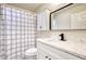 Bathroom featuring a modern vanity with white marble countertop and updated mirror at 12627 N La Montana Dr # 104, Fountain Hills, AZ 85268