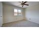 Bright bedroom featuring neutral walls, plush carpeting, and a window providing ample natural light at 12627 N La Montana Dr # 104, Fountain Hills, AZ 85268