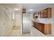 Bright kitchen featuring stainless steel appliances, wooden cabinets, and tile flooring at 12627 N La Montana Dr # 104, Fountain Hills, AZ 85268
