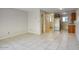 Spacious living room with tile flooring, neutral walls, and an open layout to kitchen at 12627 N La Montana Dr # 104, Fountain Hills, AZ 85268