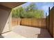 Private patio area featuring a wood fence and gravel flooring, perfect for relaxing outdoors at 12627 N La Montana Dr # 104, Fountain Hills, AZ 85268