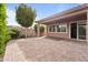 Open backyard featuring a covered patio, well maintained landscaping, and paver patio at 13110 W Avenida Del Rey --, Peoria, AZ 85383