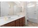 Bathroom with double vanity, large mirror and shower-tub combination at 13110 W Avenida Del Rey --, Peoria, AZ 85383
