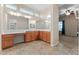 Large bathroom vanity with dual sinks, mirrors, and lights, connecting to the Primary bedroom at 13110 W Avenida Del Rey --, Peoria, AZ 85383