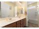 Bright bathroom featuring a double sink vanity, a large mirror, and a shower-tub combination at 13110 W Avenida Del Rey --, Peoria, AZ 85383