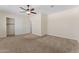 Neutral bedroom with ceiling fan, carpeted floor, walk-in closet and adjoining door at 13110 W Avenida Del Rey --, Peoria, AZ 85383