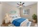 Serene bedroom features cool tones, plush bedding, and lots of natural light from the large window at 13110 W Avenida Del Rey --, Peoria, AZ 85383