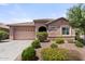 Charming single-story home featuring a tile roof and well-maintained landscaping at 13110 W Avenida Del Rey --, Peoria, AZ 85383