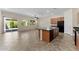 Open kitchen with a center island, tile floors, and stainless steel appliances at 13110 W Avenida Del Rey --, Peoria, AZ 85383