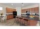Spacious kitchen with a large island, granite countertops, and dark wood cabinetry at 13110 W Avenida Del Rey --, Peoria, AZ 85383