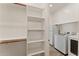 Laundry room with storage shelves and white washer and dryer appliances at 13110 W Avenida Del Rey --, Peoria, AZ 85383
