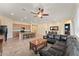 Spacious living room featuring an open floor plan, with views of the kitchen, dining area, and a comfortable seating area at 13110 W Avenida Del Rey --, Peoria, AZ 85383