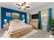 Bright main bedroom with blue accent wall, decorative lamps, and ample natural light at 13110 W Avenida Del Rey --, Peoria, AZ 85383