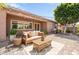 Inviting outdoor patio with cozy seating, decorative lighting, and a well-manicured backyard at 13110 W Avenida Del Rey --, Peoria, AZ 85383