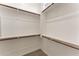 Spacious walk-in closet with white shelving and carpeted floor at 13110 W Avenida Del Rey --, Peoria, AZ 85383