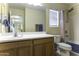Well-lit bathroom featuring a large mirror, and shower/tub combo with updated fixtures at 1325 E Brent Ct, Casa Grande, AZ 85122