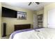 Bright bedroom features a TV, dresser, and decorative artwork for a comfortable and stylish space at 1325 E Brent Ct, Casa Grande, AZ 85122
