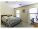 Comfortable bedroom with a queen-sized bed, a desk and chair setup by the window at 1325 E Brent Ct, Casa Grande, AZ 85122