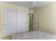 Simple bedroom boasts double closets, neutral walls, comfortable bedding, and access to a private bathroom at 1325 E Brent Ct, Casa Grande, AZ 85122
