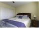 Bright bedroom featuring a ceiling fan, closet, and a comfortable bed at 1325 E Brent Ct, Casa Grande, AZ 85122