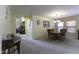 Spacious carpeted dining room featuring chandelier lighting and a large table at 1325 E Brent Ct, Casa Grande, AZ 85122
