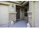 Charming entryway with stone accents and decorative statues at 1325 E Brent Ct, Casa Grande, AZ 85122