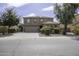 Two story home featuring landscaped front yard and three car garage at 1325 E Brent Ct, Casa Grande, AZ 85122