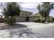 Two story home featuring landscaped front yard and three car garage at 1325 E Brent Ct, Casa Grande, AZ 85122