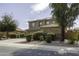Two story home featuring landscaped front yard and three car garage at 1325 E Brent Ct, Casa Grande, AZ 85122